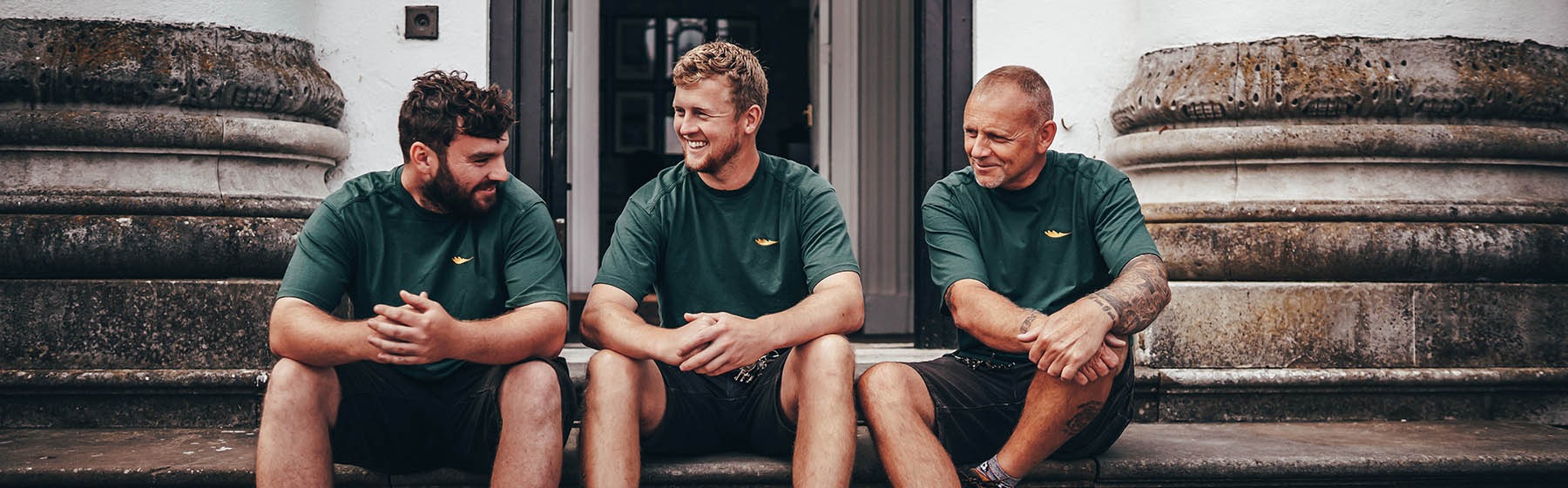 gardening team resting on a step